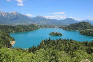 an island in the middle of a lake at Bled4U Apartment in Bled