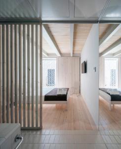 a bedroom with two beds in a room at Hotel Santacreu in Tabarca