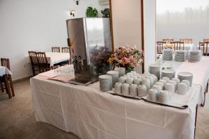 a table with white plates and cups on it at Mobile homes Bonaca in Srima