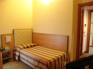 Ένα ή περισσότερα κρεβάτια σε δωμάτιο στο Hotel Kristall