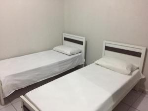 Katil atau katil-katil dalam bilik di Alto Serra Hotel