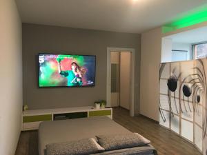 TV a/nebo společenská místnost v ubytování B&B ARCOBALENO