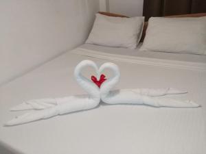 Postel nebo postele na pokoji v ubytování Zenith Inn & Resto Bar