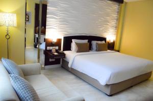 Krevet ili kreveti u jedinici u okviru objekta Hotel New Saphir Yogyakarta