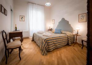 Posteľ alebo postele v izbe v ubytovaní Santa Felicita Apartments