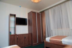 Aska Hotel客房内的一张或多张床位