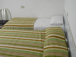 A bed or beds in a room at Casa Armanda