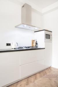 
A kitchen or kitchenette at Maison BON Apartments
