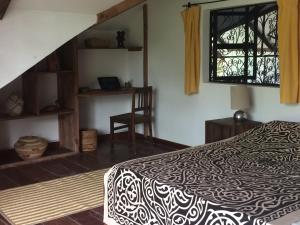 Ένα ή περισσότερα κρεβάτια σε δωμάτιο στο Villa Matalai