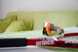 a pair of sunglasses sitting on top of a remote control at Ingrappa Sporthouse in Borso del Grappa