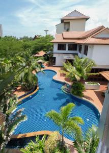 an overhead view of a swimming pool in front of a house at The Orchid Beach Resort @ VIP Chain Resort in Ban Phe