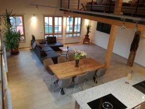 a living room with a table and a couch at Bed & Bike in Trichtingen