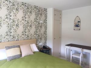Кровать или кровати в номере Hotel Nómadas