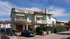 a car parked in front of a house at App. Marjeta in Umag