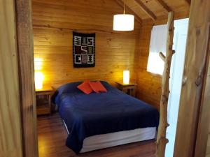 Postel nebo postele na pokoji v ubytování Cabaña Rincón de Manzano