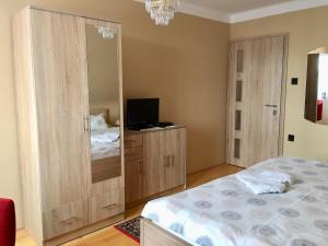 A bed or beds in a room at Németh Vendégház