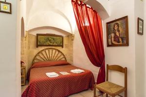 Postel nebo postele na pokoji v ubytování B&B Borgo San Martino