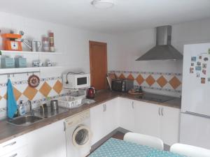 A kitchen or kitchenette at Casa del Sol