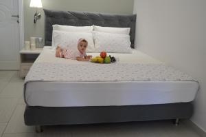 Łóżko lub łóżka w pokoju w obiekcie Aqua Luxury Villas
