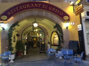 an entrance to a restaurant with blue tables and chairs at Terrasse Wohnungen mit parking in Zentrum in Baden