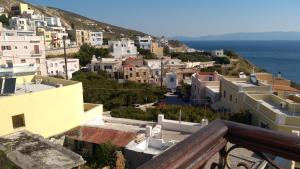 a view of a town with the ocean at Vaporia in Ermoupoli