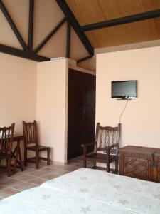 En tv och/eller ett underhållningssystem på Alojamiento Rural Fuente Cancana