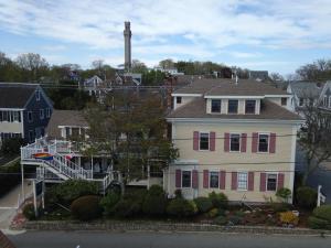 a large white house with red shutters at Watership Inn in Provincetown