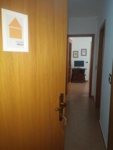 a door leading into a room with a hallway at Akron B&B in SantʼAlessio Siculo