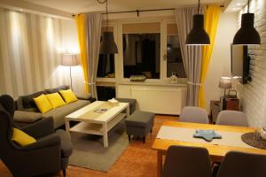 Telewizja i/lub zestaw kina domowego w obiekcie Apartamenty Usteckie