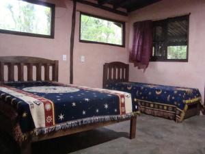 Postel nebo postele na pokoji v ubytování Pousada Vida Artesanal
