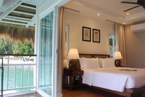 Кровать или кровати в номере El Nido Resorts Apulit Island