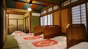 Postel nebo postele na pokoji v ubytování Japanese Guesthouse Kinosaki Wakayo (Female Only) + 33 fotografií