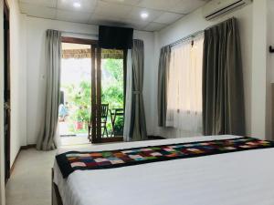 Giường trong phòng chung tại Ananda Resort