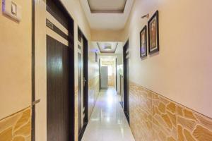a corridor of a building with a hallway at Hotel K.C Residency in Mumbai