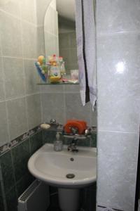 a bathroom with a sink and a mirror at Paradise Corner in Pomorie +8 photos