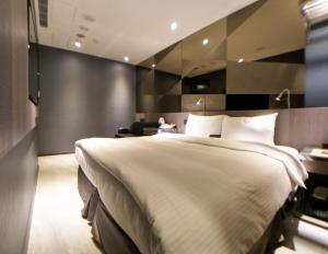 Ліжко або ліжка в номері Beauty Hotels Taipei - B7 Journey