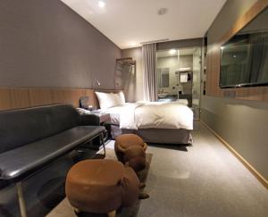 Ліжко або ліжка в номері Beauty Hotels Taipei - B7 Journey