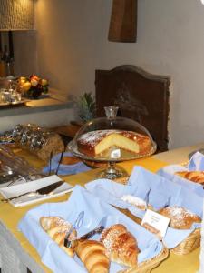 a table that has some food on it at Castello di Bibbione in San Casciano in Val di Pesa
