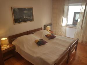 Postel nebo postele na pokoji v ubytování Apartman Nadia