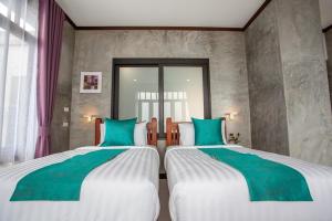 Katil atau katil-katil dalam bilik di Lanta Corner Resort