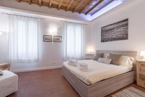 a bedroom with a large bed in a room at Santa Croce Place by Mmega in Florence
