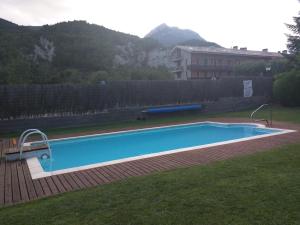 a swimming pool in the yard of a house at Hostal Cal Batista in Bagá +60 photos