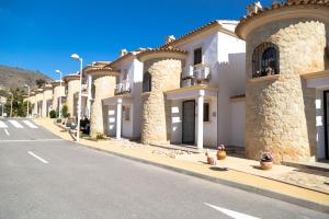 a row of houses on the side of a street at Calanuza in El Campello