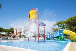 a pool with a water park with a water slide at Hipotels Barrosa Garden in Chiclana de la Frontera