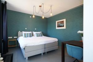 Postel nebo postele na pokoji v ubytování De Kempse Hoeve B&B