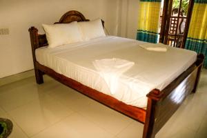 Letto o letti in una camera di Thuruliya Residence