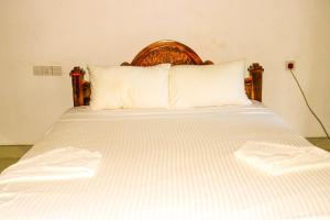 Letto o letti in una camera di Thuruliya Residence
