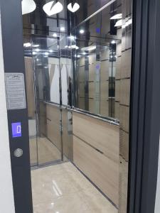 a glass door with a bunch of mirrors at Kraljev Park (King's Park) in Novi Sad
