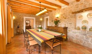 a kitchen and dining room with a table and chairs at Villa Truc in Pollença