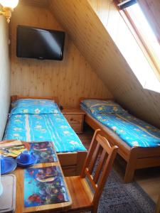 Postel nebo postele na pokoji v ubytování Dom Gościnny Anastazja